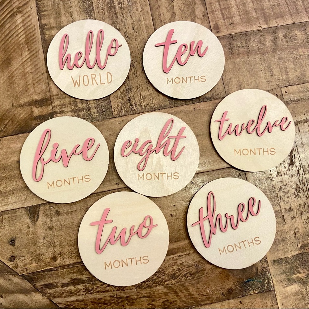 Pink wooden monthly milestone photo discs